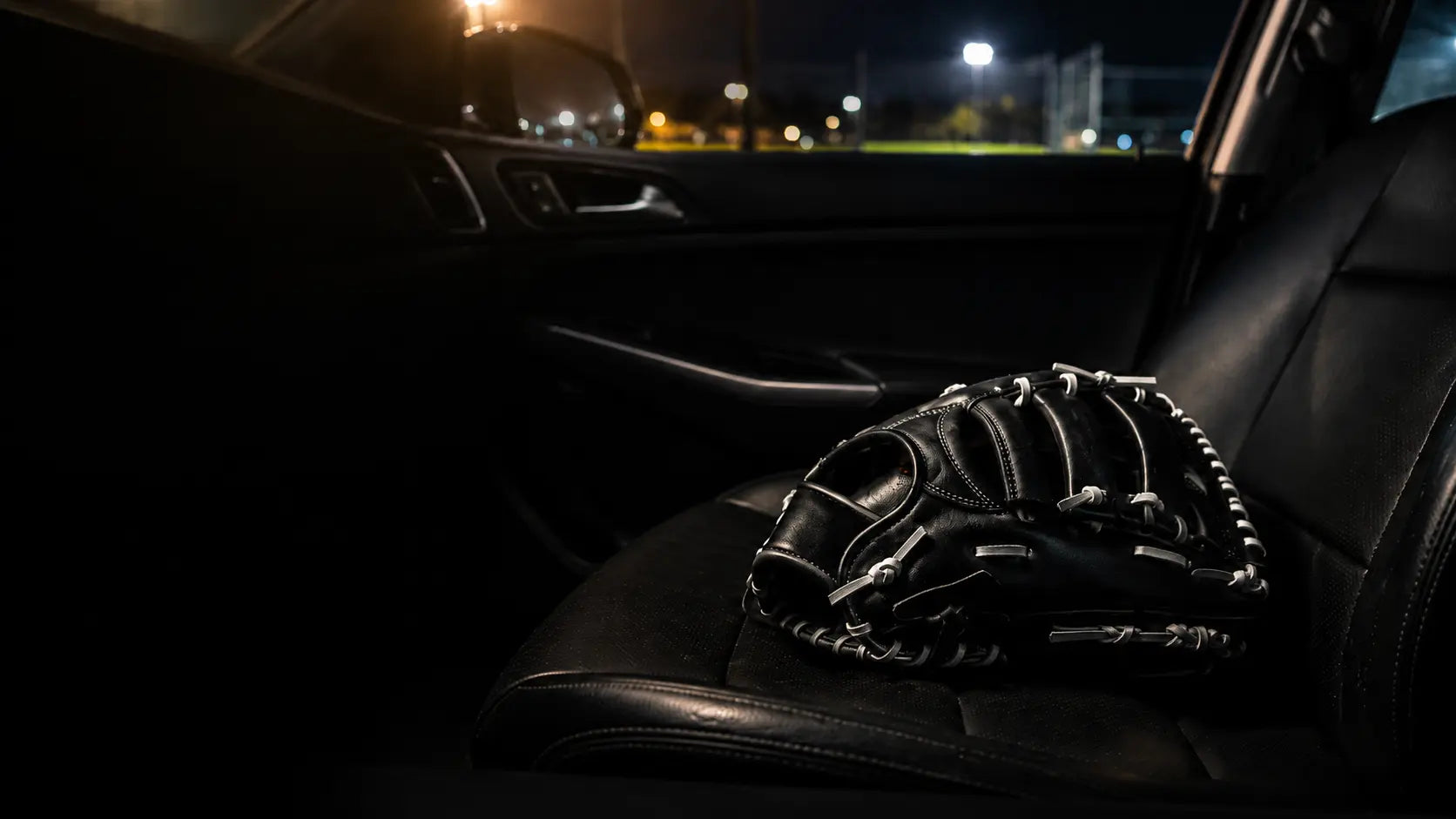 Baseball glove on a car seat for pickup and drop-off service